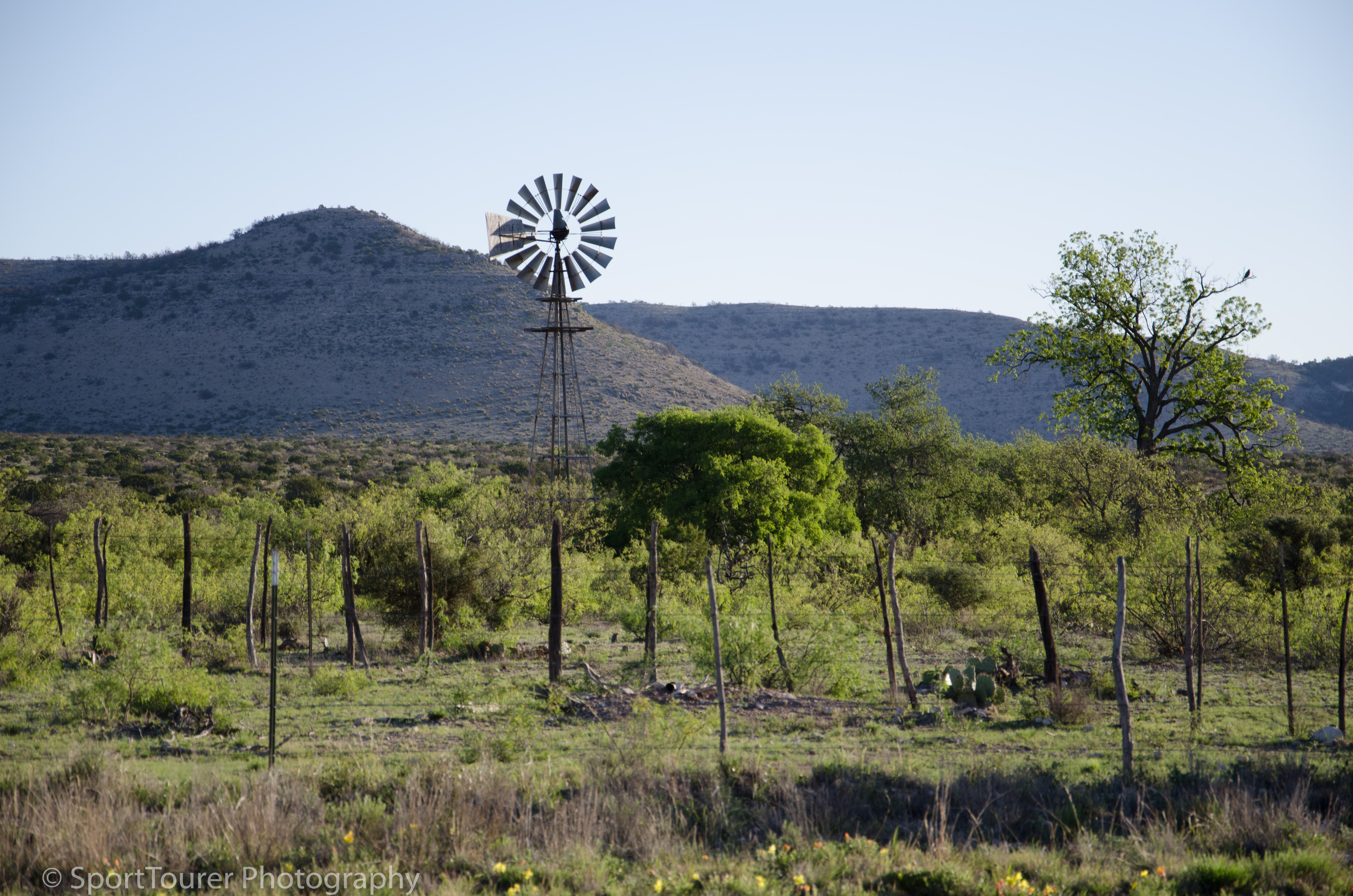  On a day without breeze, this windmill stands still on Texas ranch land 