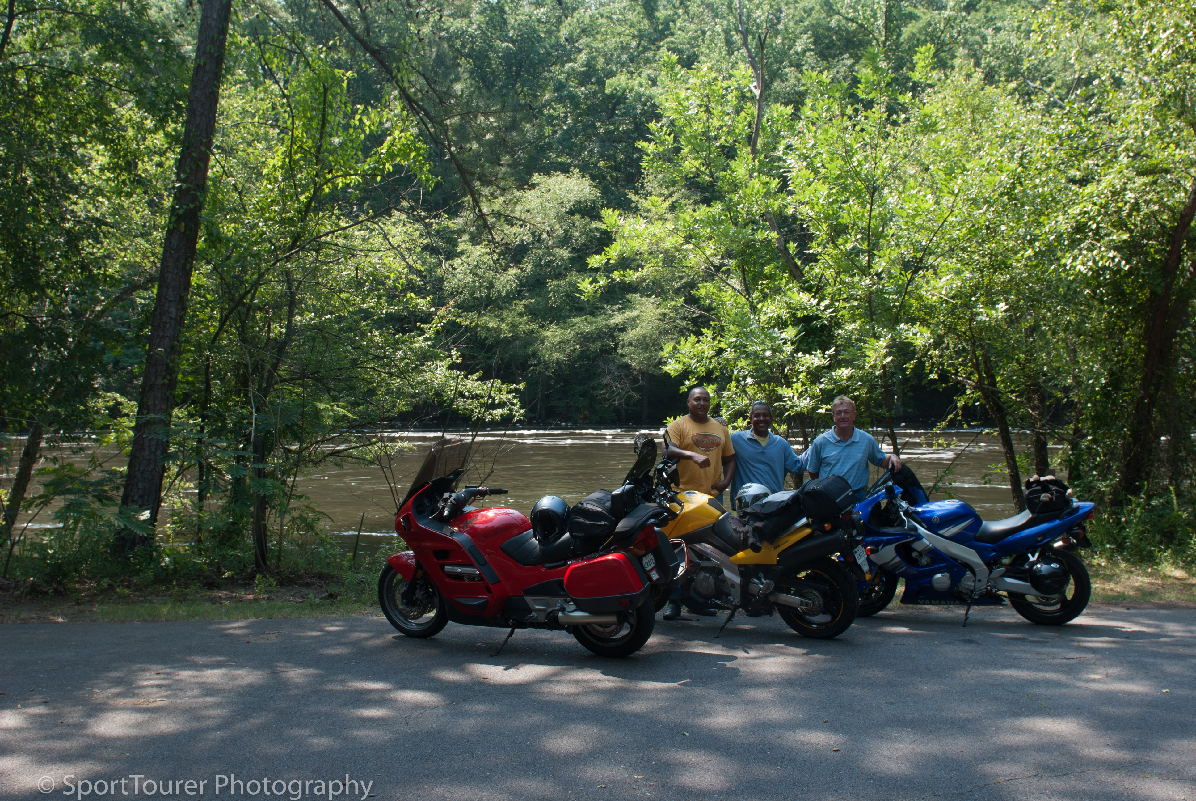  Downstream of the flood control dam, we posed for this photo, with the air dominated by the smell of sulphur, by the Sulphur Springs River 