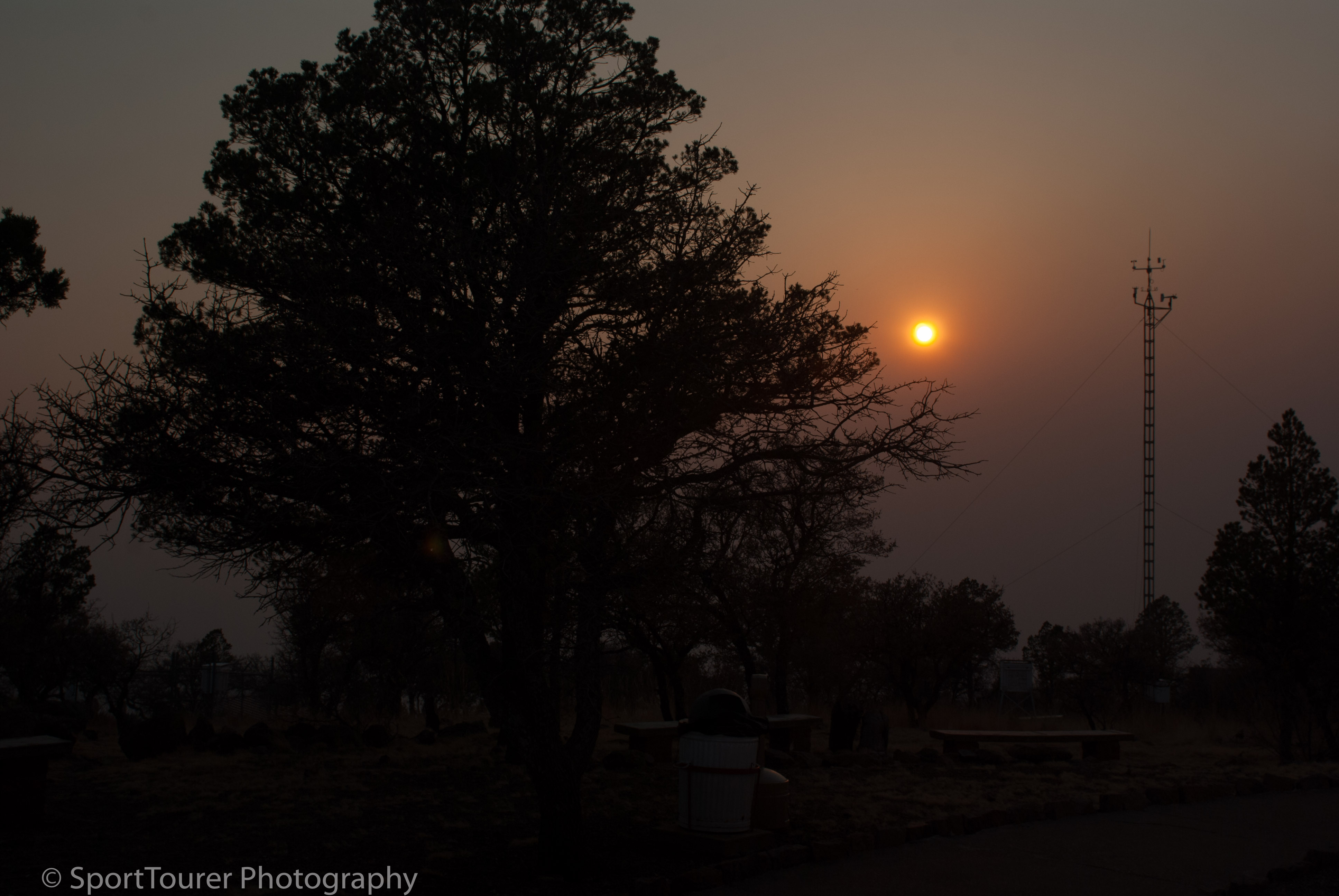  Sunset through the haze of a still smoke-filled valley after wild fires had raged the previous week. 