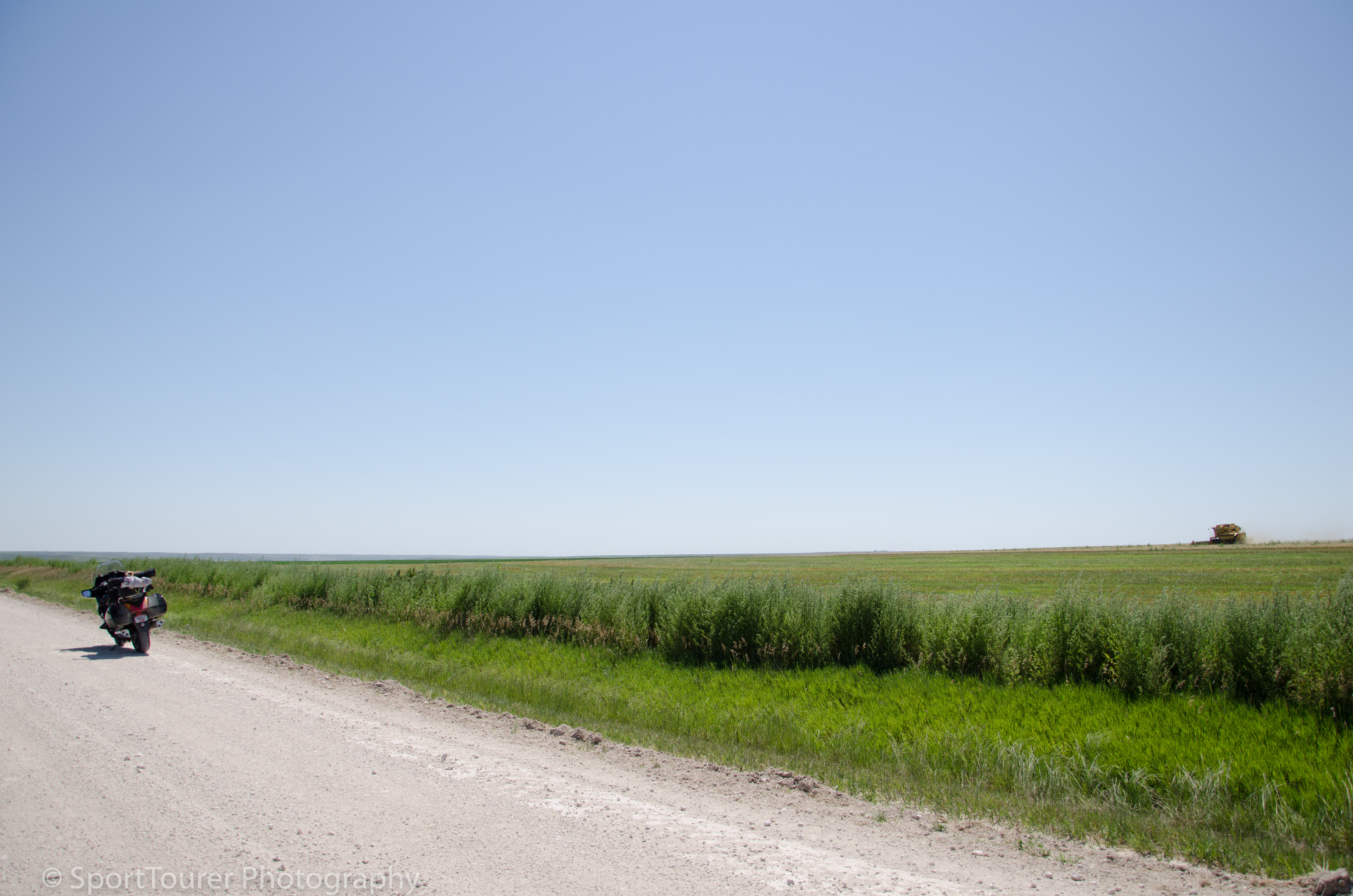  As I waited for a pilot truck to guide us through road construction on Kansas Highway 36, I took time out to watch this equipment make light work of its harvesting duties. 