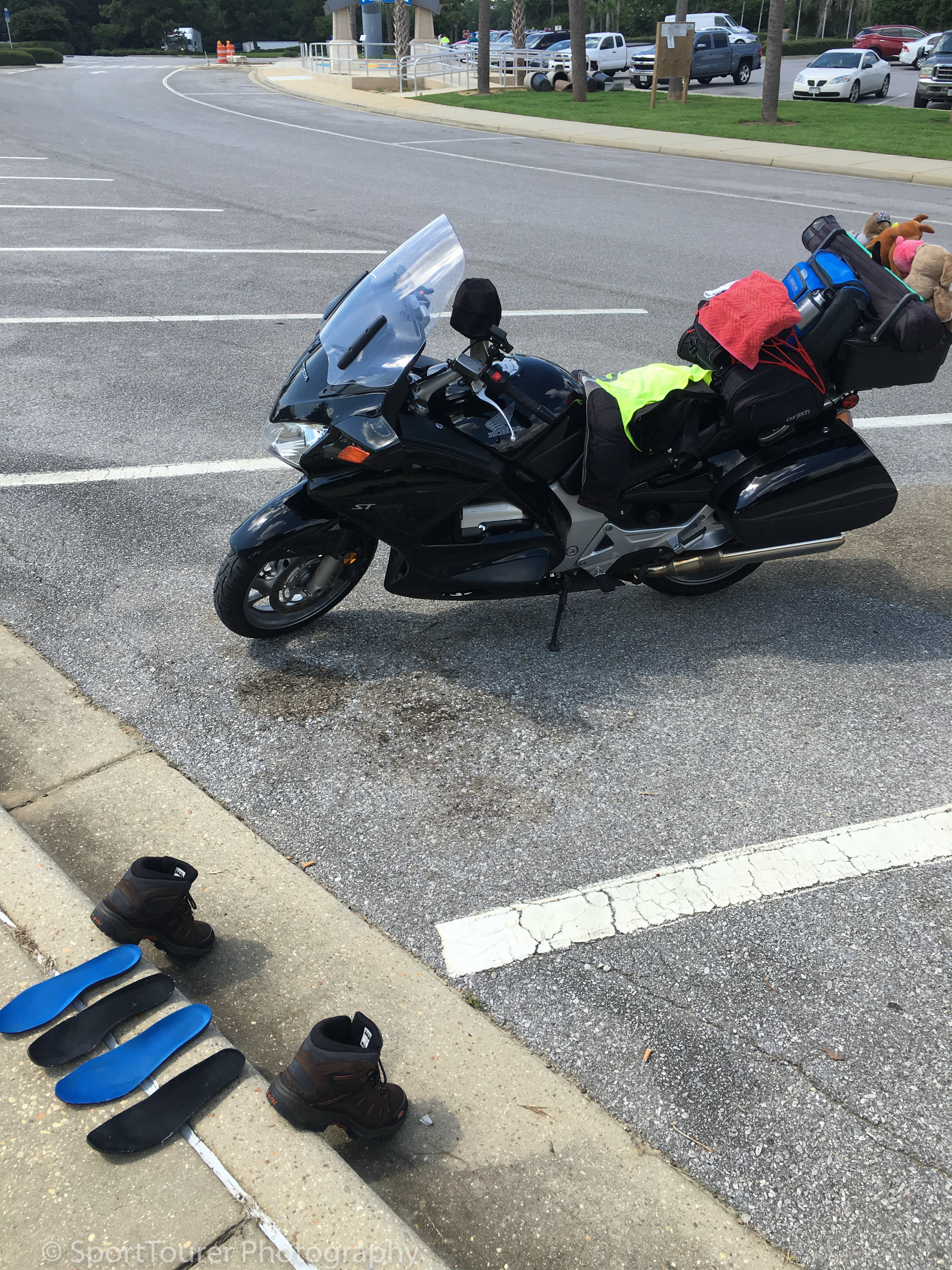  Taking advantage of the heat of a summer day in Pensacola, FL to dry out my still-wet boots. 