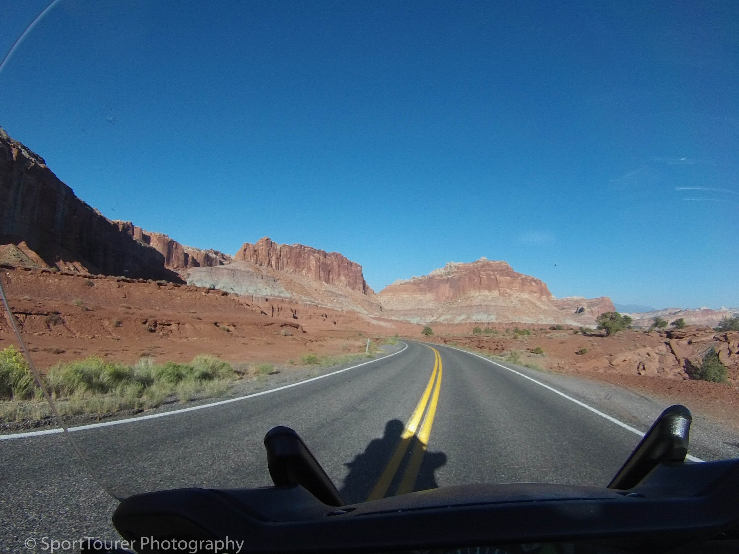  My ever-present riding buddy, leading the way through Capitol Reef national Park 