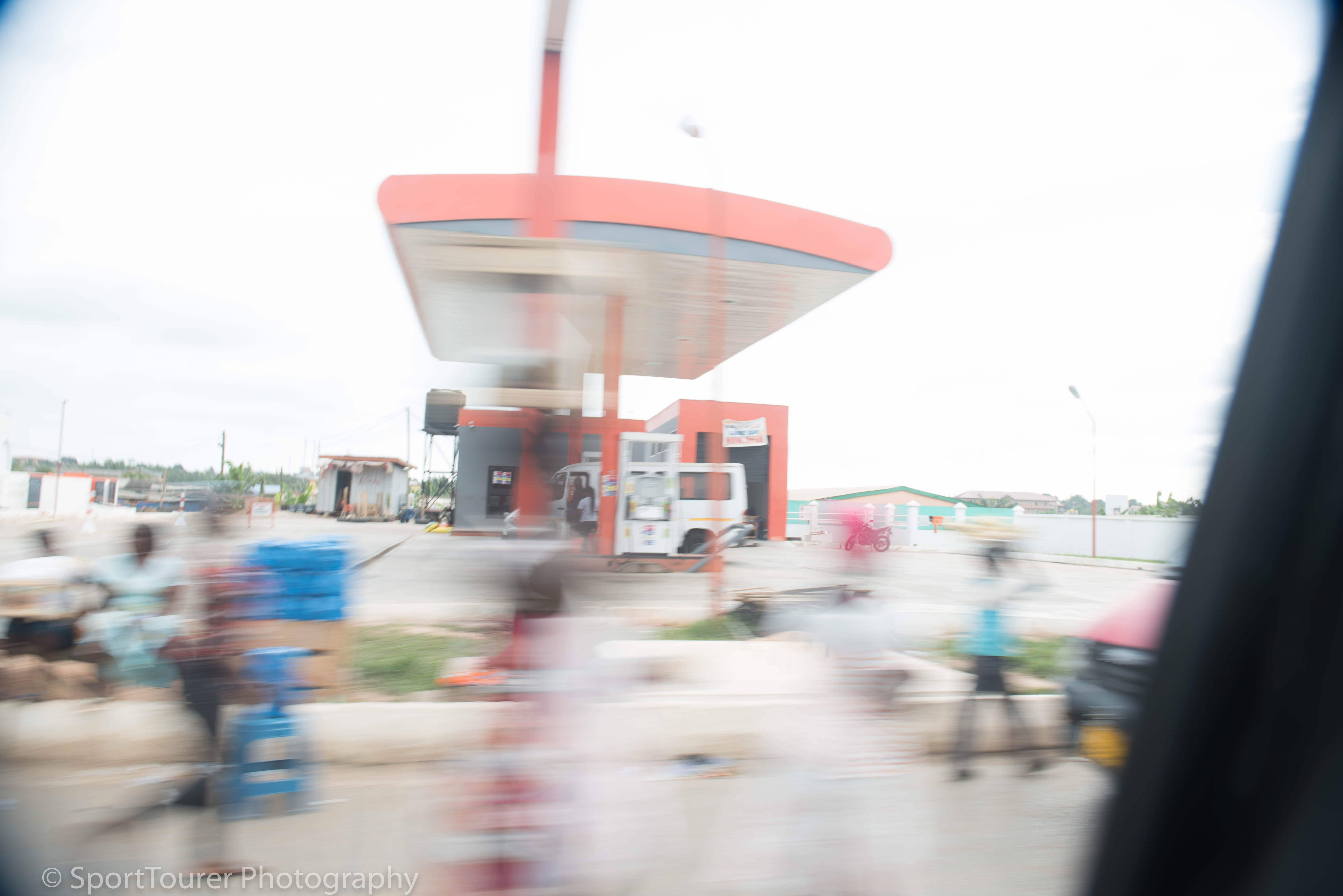  The old Ghana Oil gas station in Mankesim, Ghana. Having sprouted a canopy over what used to be a solitary gas (petrol) pump, the security light still exists. And co-incidentally, a motorcycle stands in pretty much the same location mine stood when stranded that unforgettable night back in 1978. 