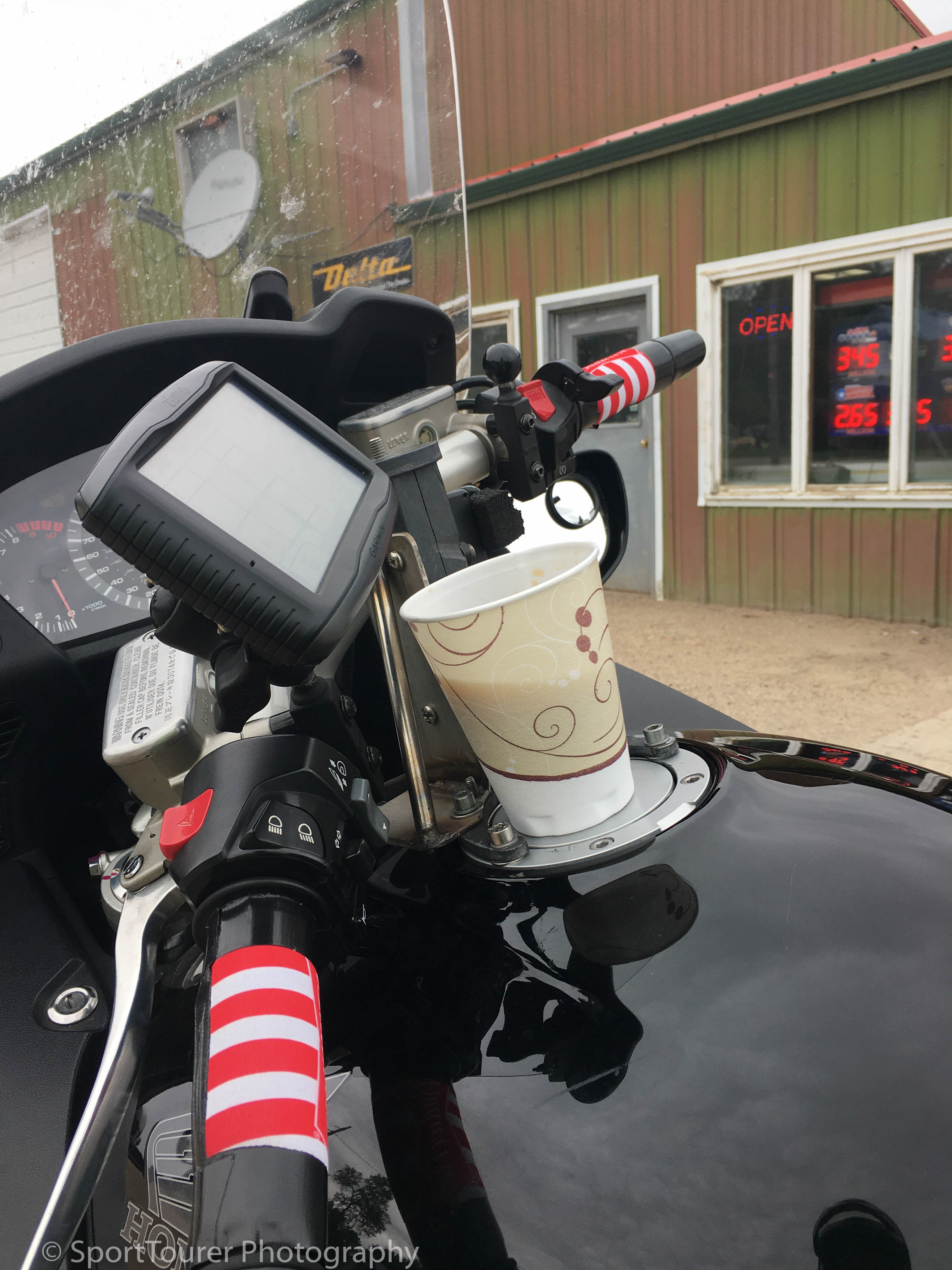  On vacation with time on my hands, a reliable road machine, a pre-planned route/ride, a full tank of gas, custom-fashioned grips for improved comfort to ward off fatigue and a cup of coffee to keep me awake as I galavant through 